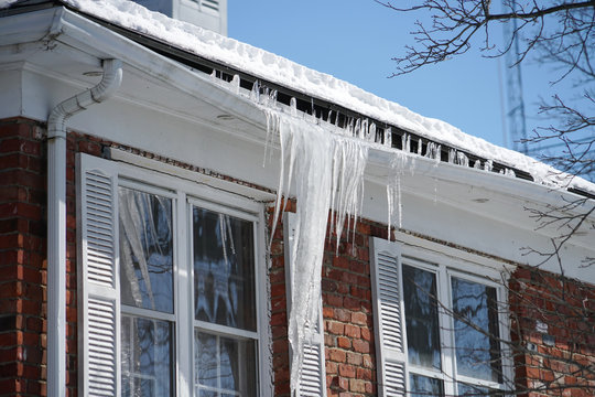 16 tips to winterize your home and save on electric bill Littleton. Frozen gutters.